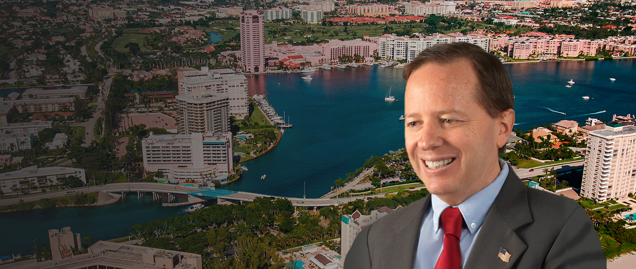 Randy Zeldin with a photograph of a dock in the background